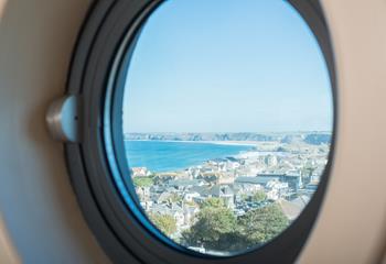 Get a glimpse of the sea from this cabin-style window. 