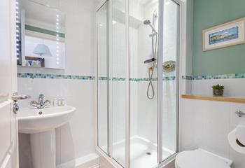 Cool off in the en suite shower after a fun day at the beach.