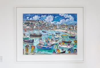 We love the coastal themed artwork in the property, like this vibrant painting of St Ives. 