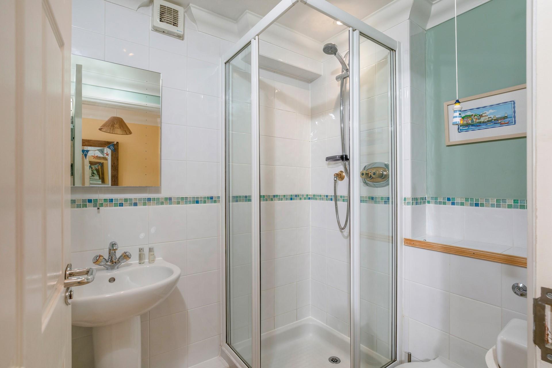 Cool off in the en suite shower after a fun day at the beach.