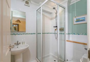Cool off in the en suite shower after a fun day at the beach.