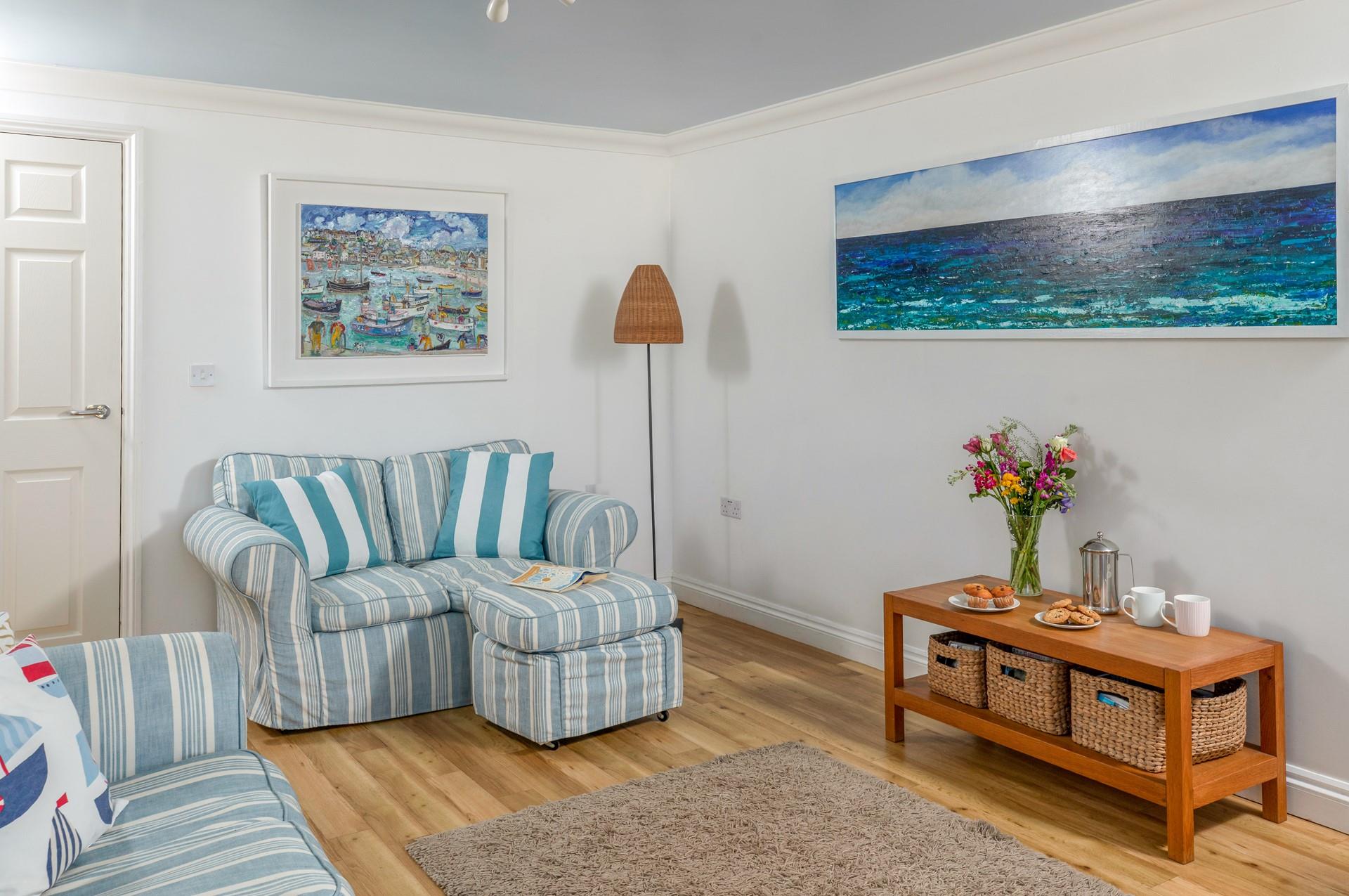 We love the finishing touches which add splashes of colour to the sitting room. 