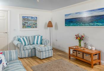 We love the finishing touches which add splashes of colour to the sitting room. 
