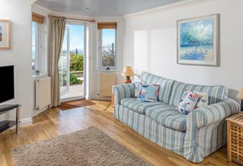 Sink into one of the comfy sofas and watch some TV, or simply enjoy the wonderful sea views. 