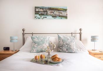 The bedroom is decorated in relaxing shades of blue and cream while the painting reminds you just how close to Mevagissey harbour you are!