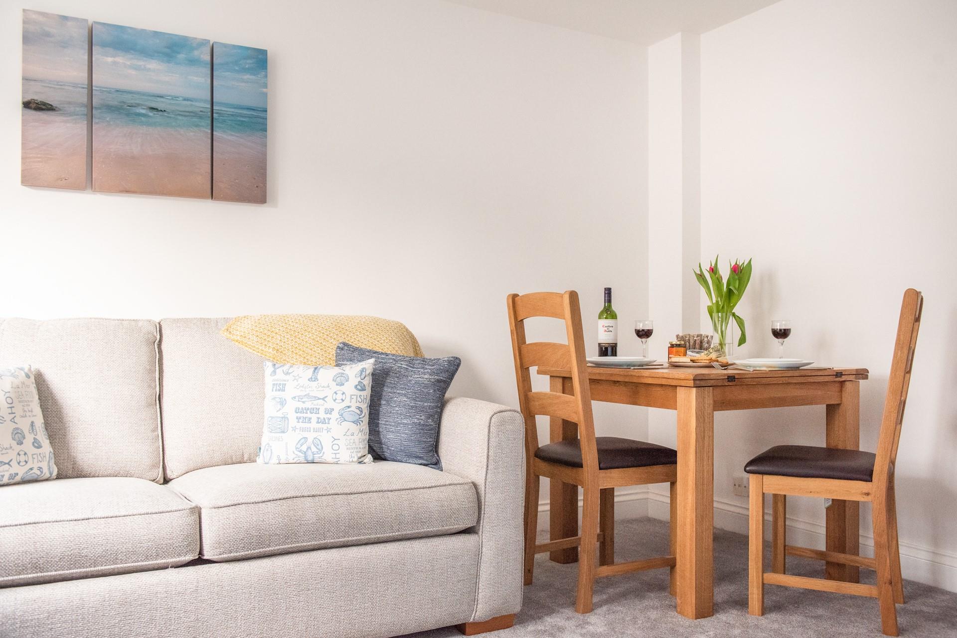 The table is an intimate space for two to indulge in a meal and a glass of wine together.