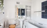 The spacious family bathroom has a heated towel rail to keep you toasty after your bath or shower. - Thumbnail Image