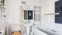 The spacious family bathroom has a heated towel rail to keep you toasty after your bath or shower.
