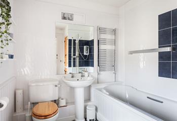 The spacious family bathroom has a heated towel rail to keep you toasty after your bath or shower.