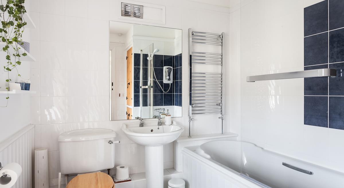 The spacious family bathroom has a heated towel rail to keep you toasty after your bath or shower.