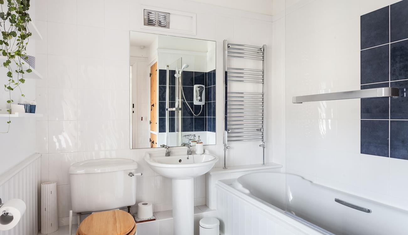 The spacious family bathroom has a heated towel rail to keep you toasty after your bath or shower.