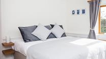 Drift off to sleep in the comfy king size bed.