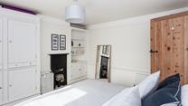 There's plenty of space to make yourself at home in this beautiful bedroom.