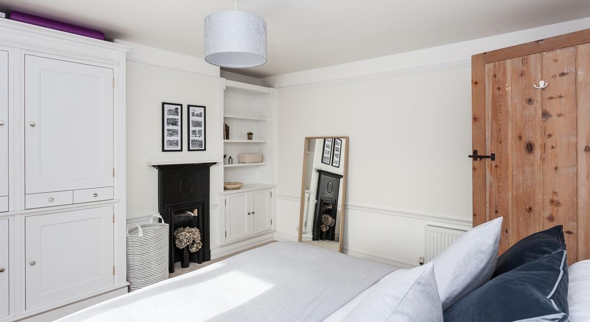 There's plenty of space to make yourself at home in this beautiful bedroom.