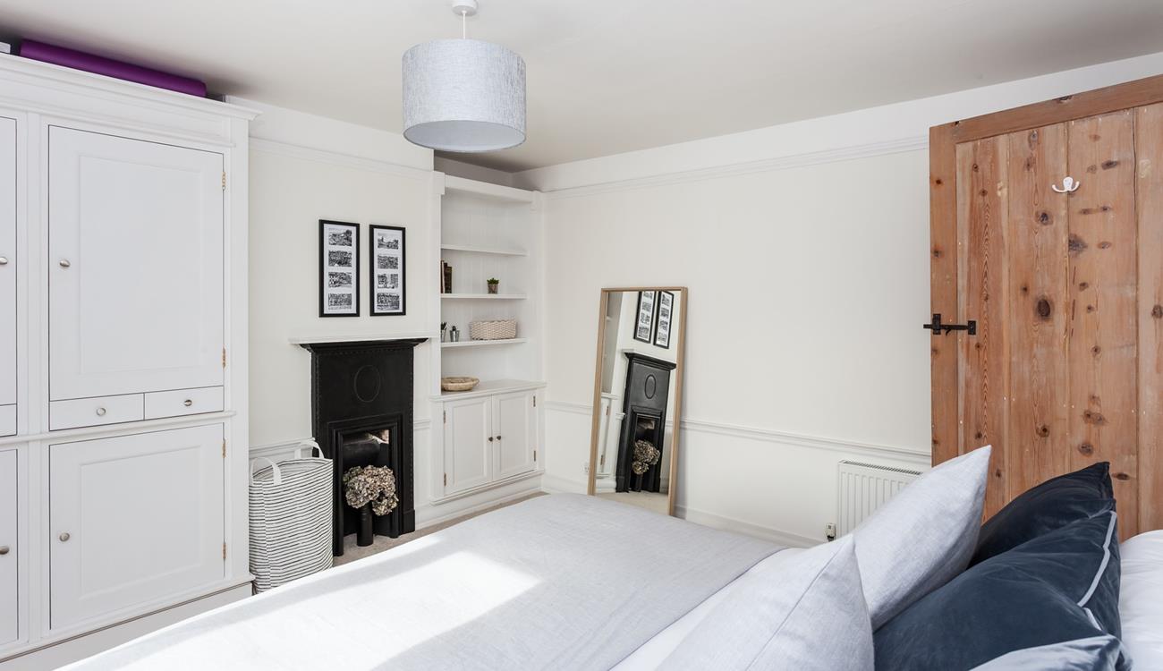 There's plenty of space to make yourself at home in this beautiful bedroom.