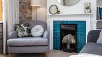 There's plenty of comfy seating for everyone to relax and enjoy a film together. 