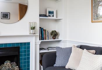 Curl up in this cosy corner after a day of coastal adventures. 