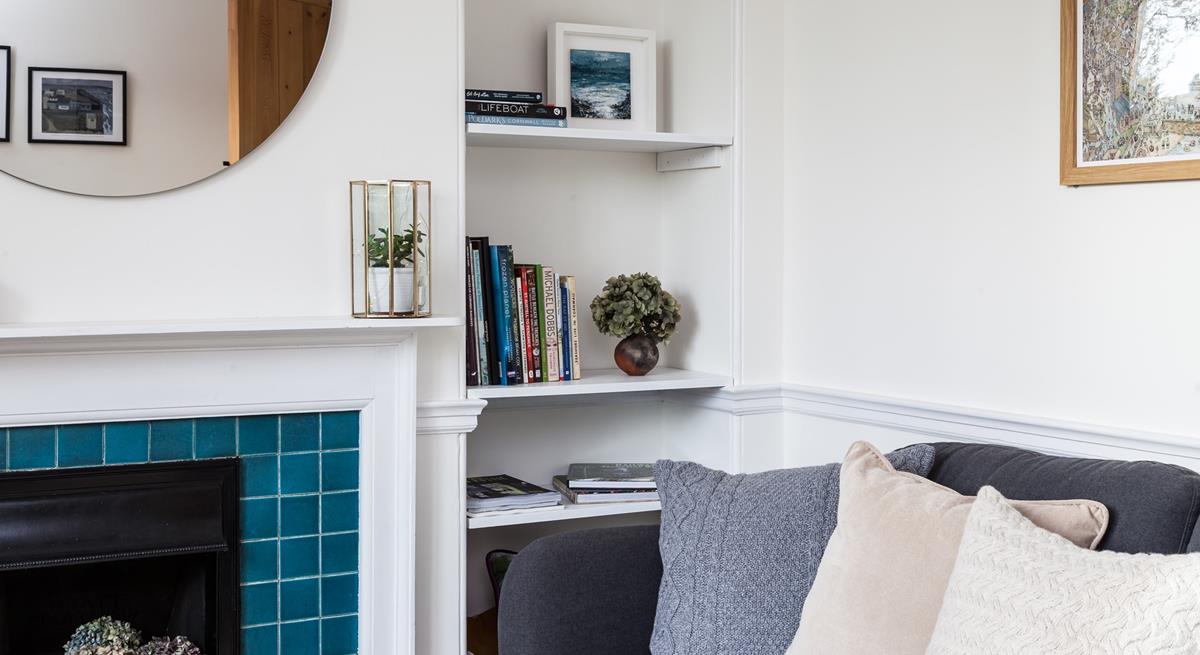 Curl up in this cosy corner after a day of coastal adventures. 