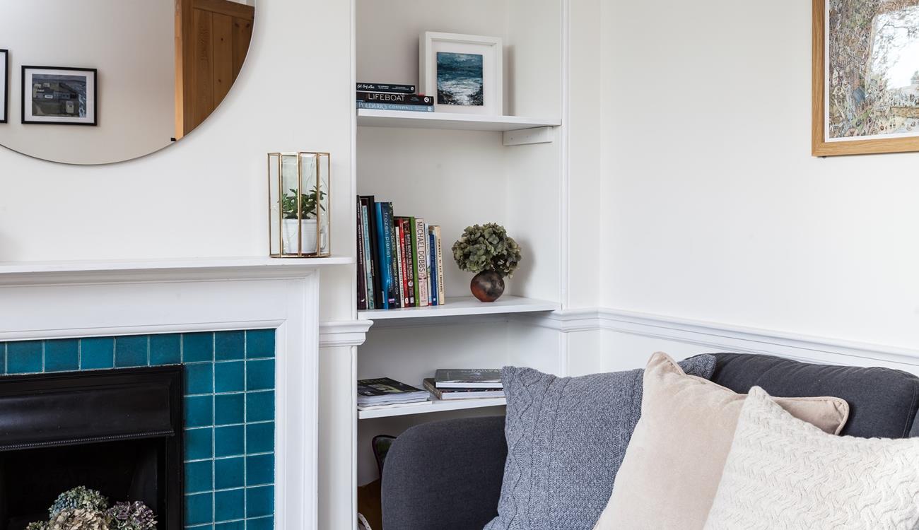 Curl up in this cosy corner after a day of coastal adventures. 