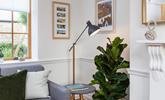 Curl up with a good book beside the reading lamp.  - Thumbnail Image