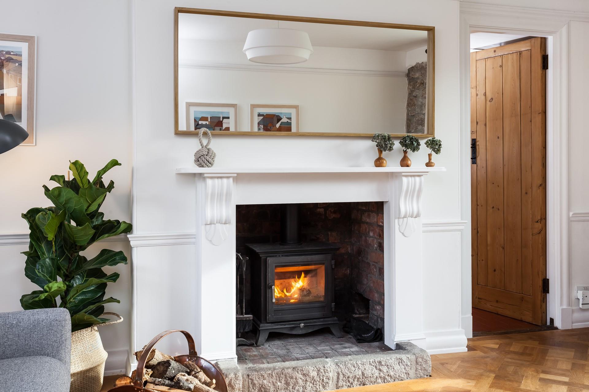 Snuggle up and warm your toes by the cosy woodburner.