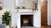 Snuggle up and warm your toes by the cosy woodburner.