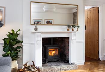 Snuggle up and warm your toes by the cosy woodburner.