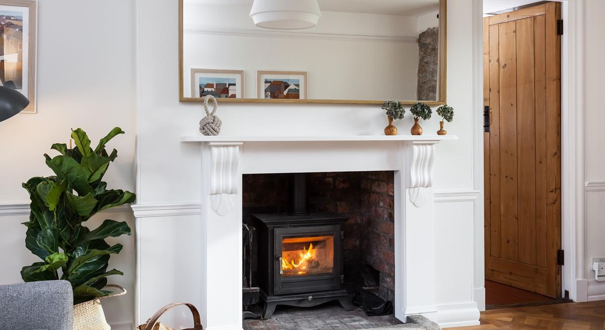 Snuggle up and warm your toes by the cosy woodburner.