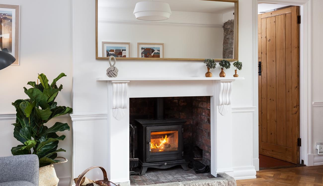 Snuggle up and warm your toes by the cosy woodburner.