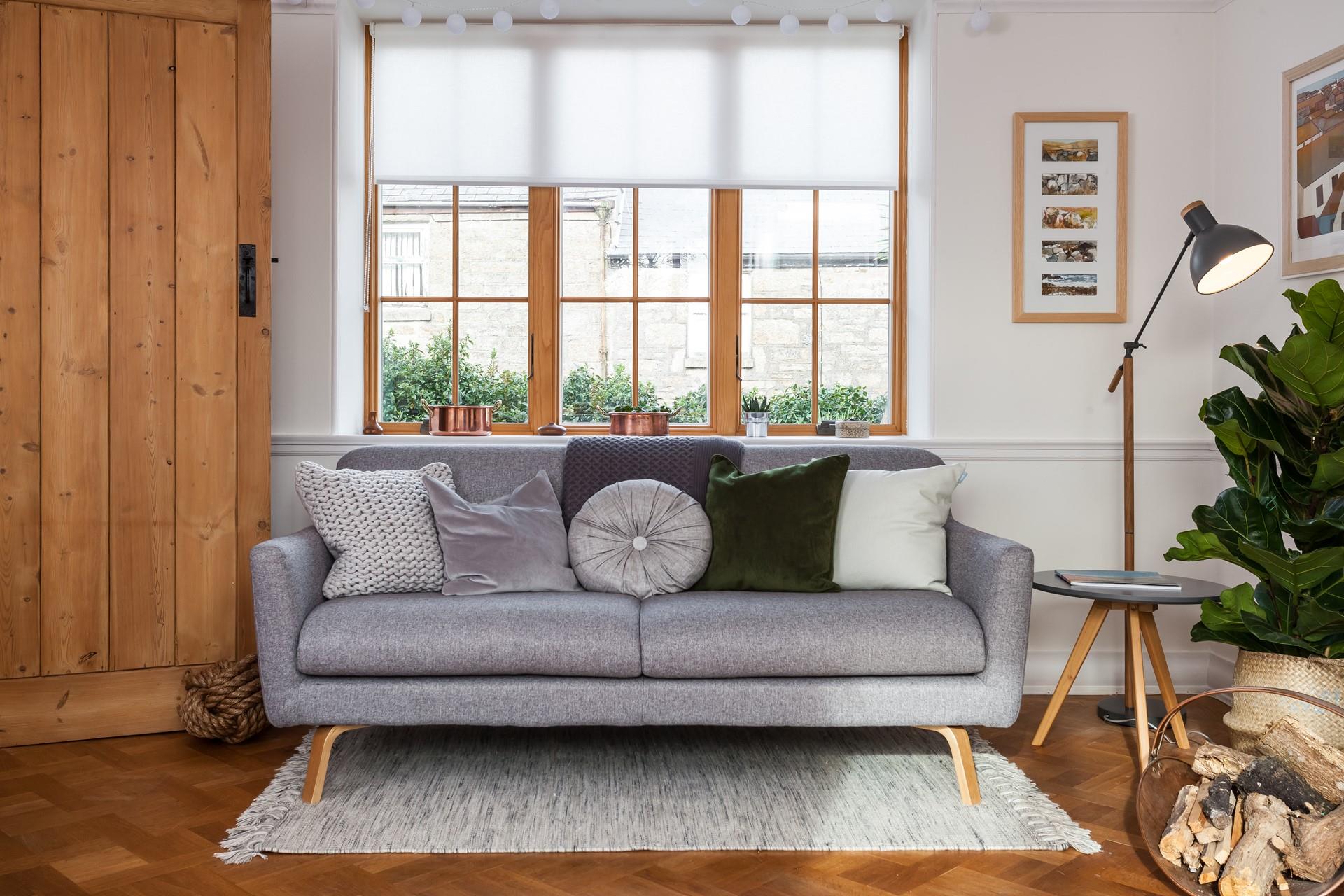 Recline on the comfy sofa in the sitting room, next to the woodburner. 
