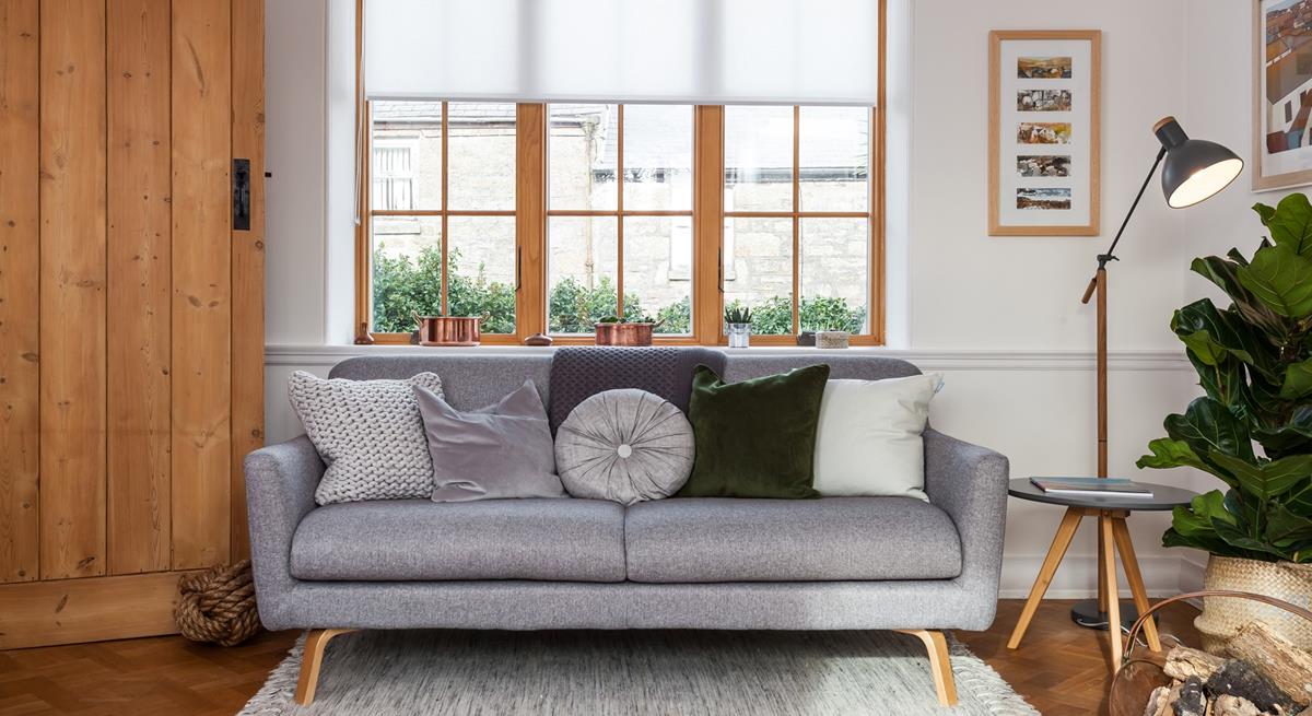 Recline on the comfy sofa in the sitting room, next to the woodburner. 