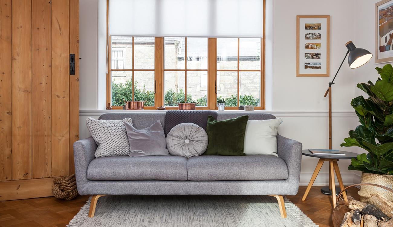 Recline on the comfy sofa in the sitting room, next to the woodburner. 