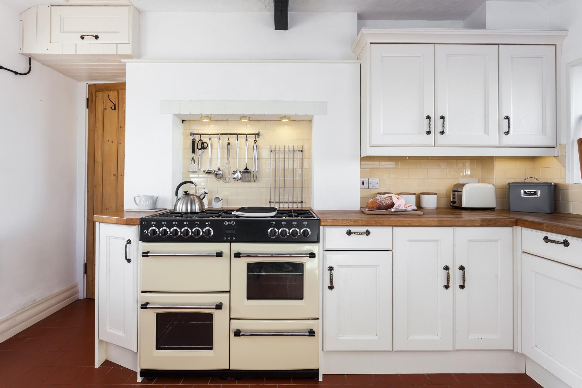 Cooking is hassle free in this spacious kitchen which has everything you need to create a culinary delight. 