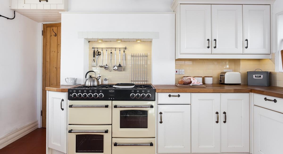 Cooking is hassle free in this spacious kitchen which has everything you need to create a culinary delight. 