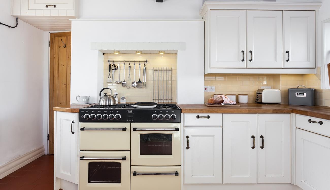 Cooking is hassle free in this spacious kitchen which has everything you need to create a culinary delight. 