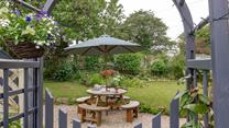 Start your day with a hot cup of tea under the apple trees.