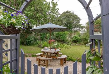 Start your day with a hot cup of tea under the apple trees.