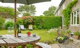 Pop open a bottle of prosecco and soak up the sun in the garden. - Thumbnail Image