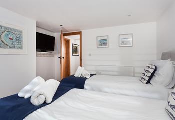 A tranquil, coastal bedroom, which can offer a king size or twin bedroom.