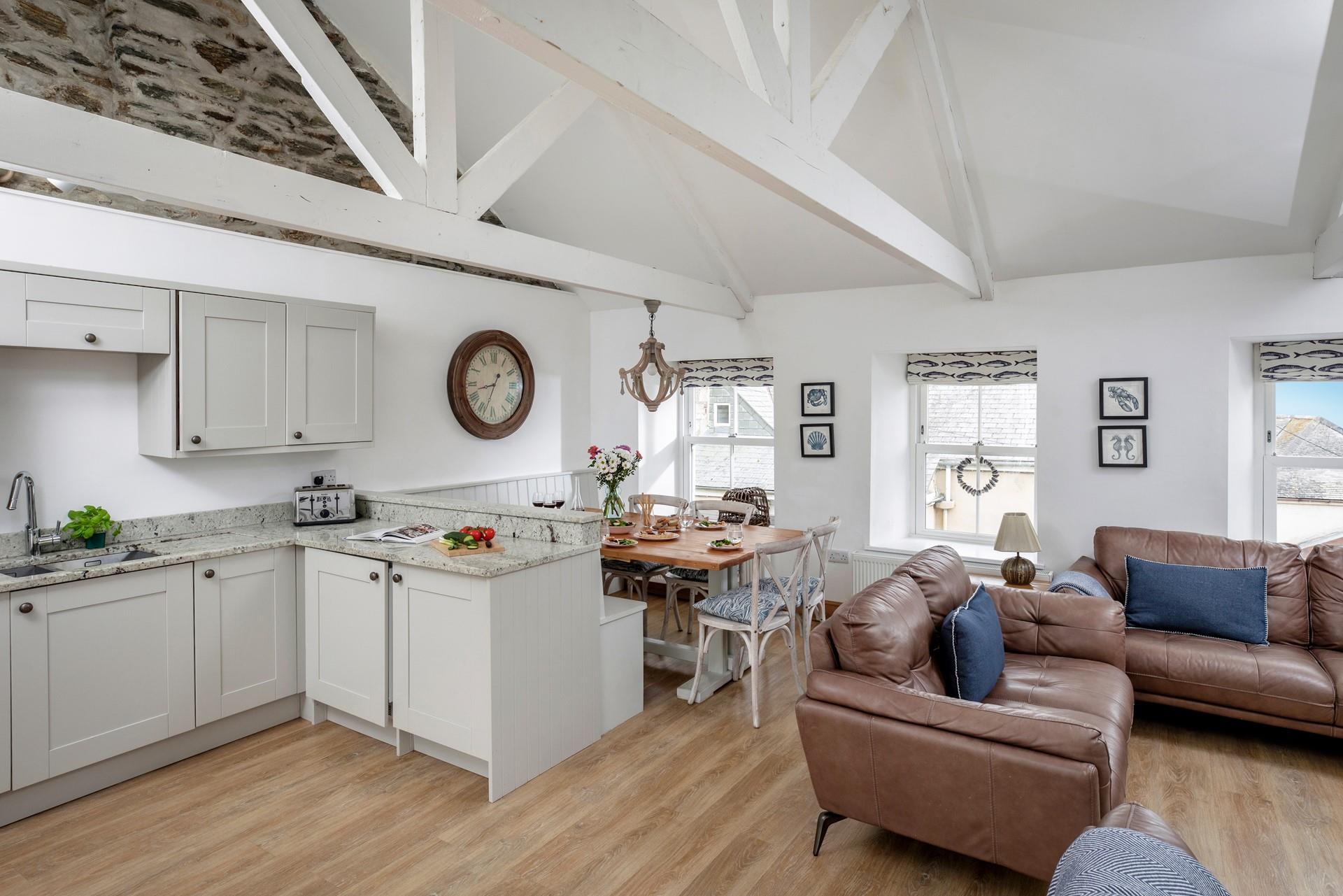 Beautiful exposed beams and the vaulted ceiling create a welcoming space.