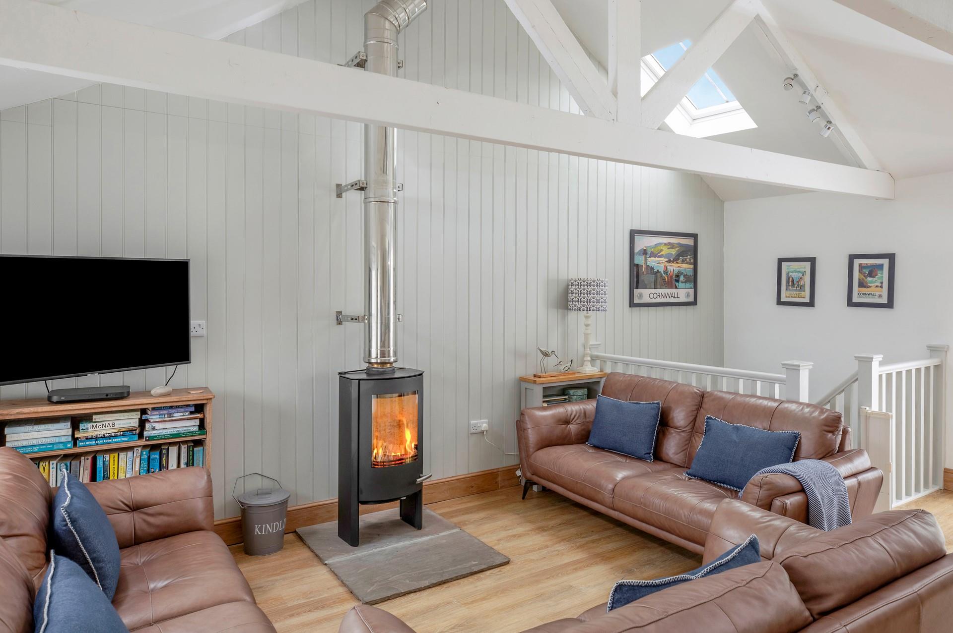 Sink into a comfy sofa with a cuppa and a good book in front of the woodburner.