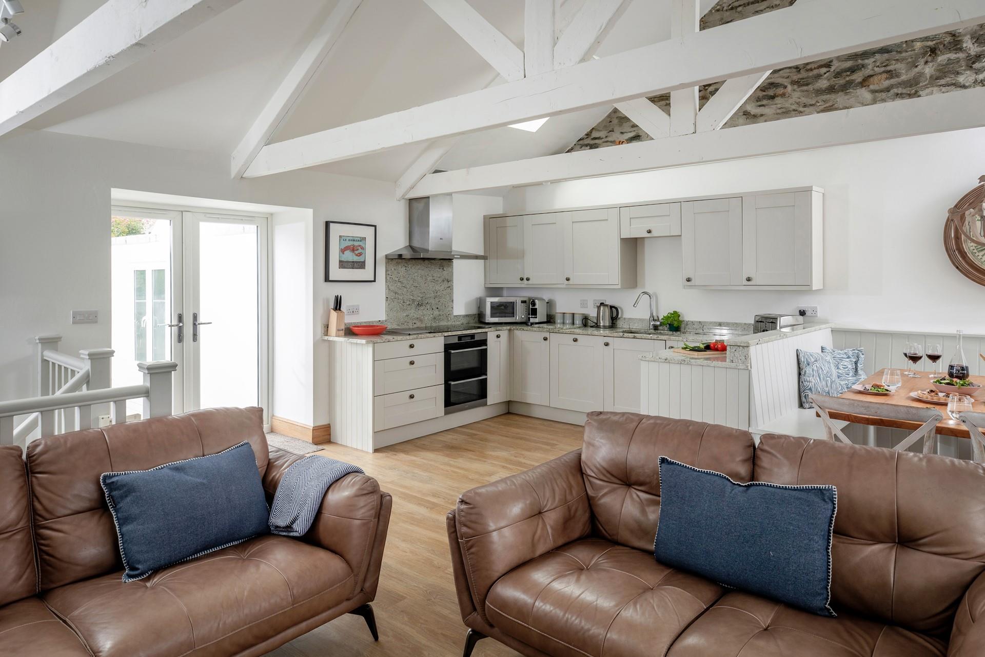 Relax, eat and drink together in the spacious open plan living area.