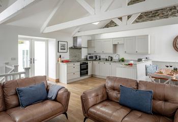 Relax, eat and drink together in the spacious open plan living area.