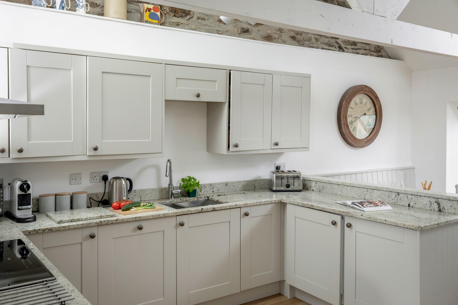 The kitchen has all the amenities you need for a relaxing holiday.