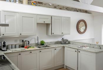 The kitchen has all the amenities you need for a relaxing holiday.