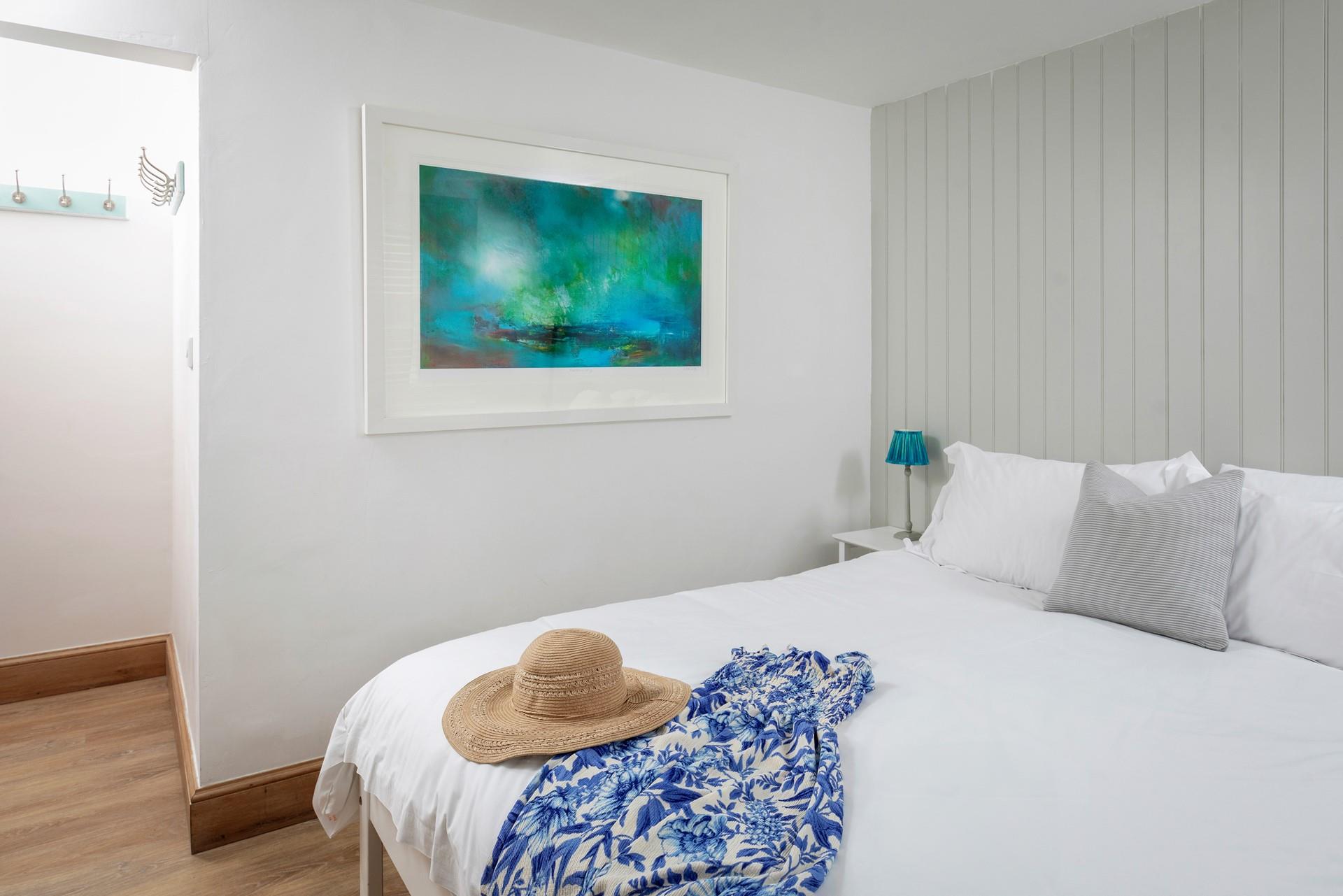 Calming hues and simple decor ensure a relaxing night's sleep.