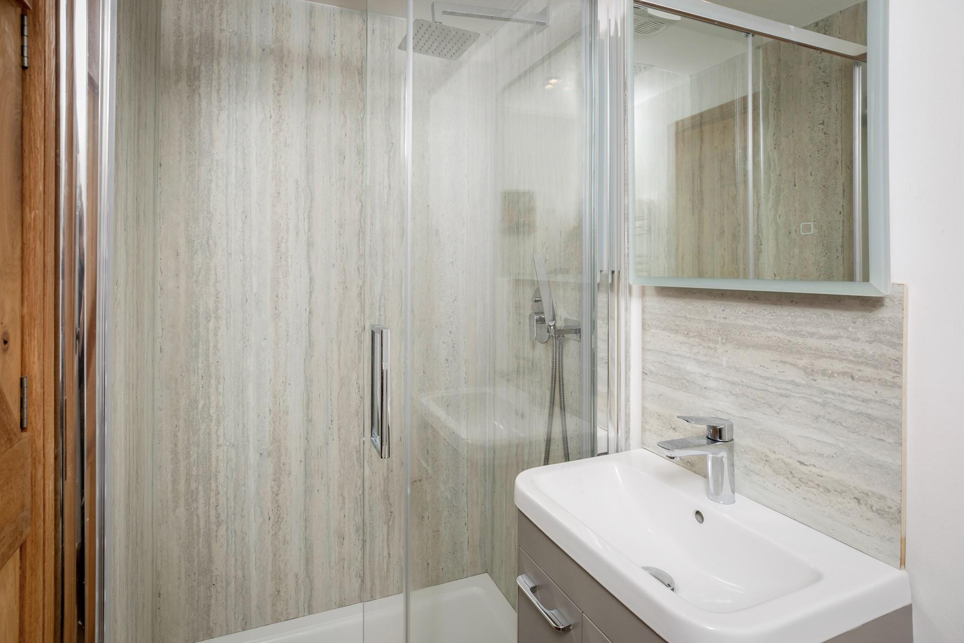 Enjoy a refreshing rinse under the luxurious rainfall shower.