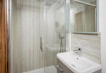 Enjoy a refreshing rinse under the luxurious rainfall shower.
