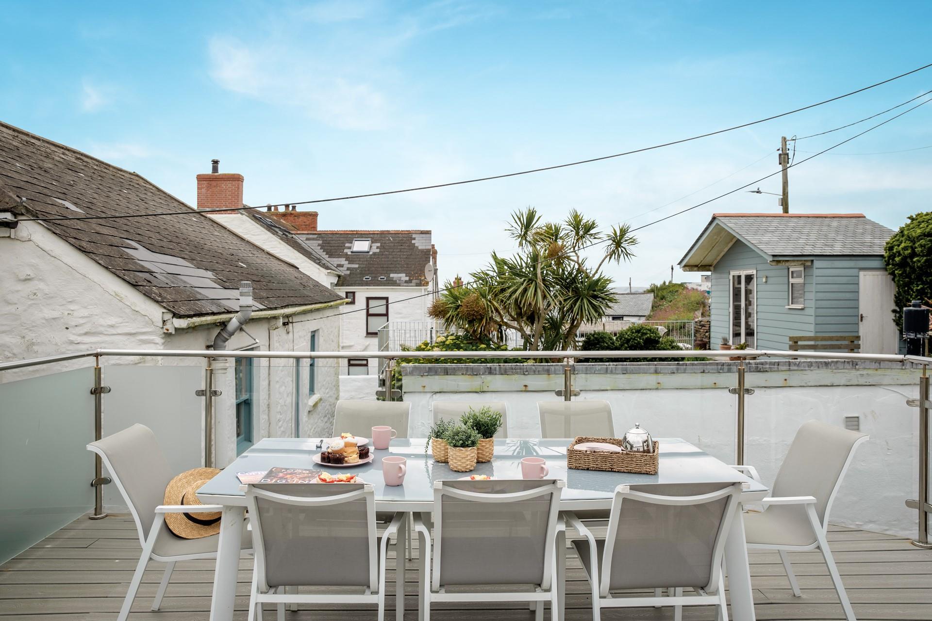 Spend balmy evenings dining on the roof terrace.