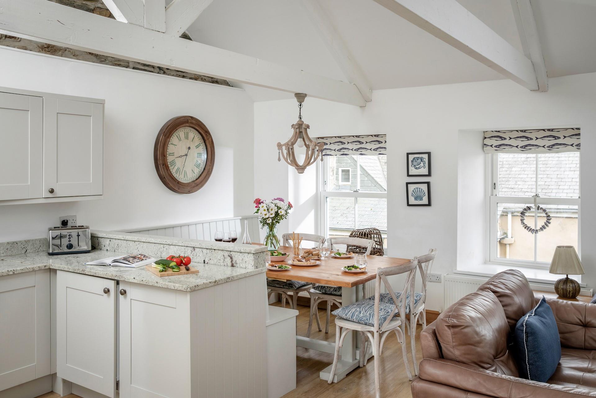 Gather around the large dining table to enjoy a family meal or board game.